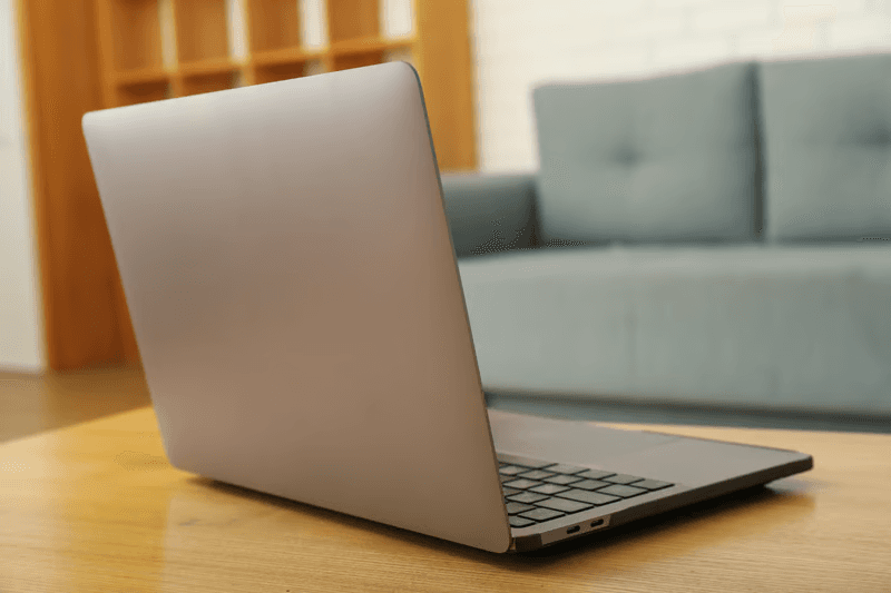 Laptop computer in workspace ready for developer or support session