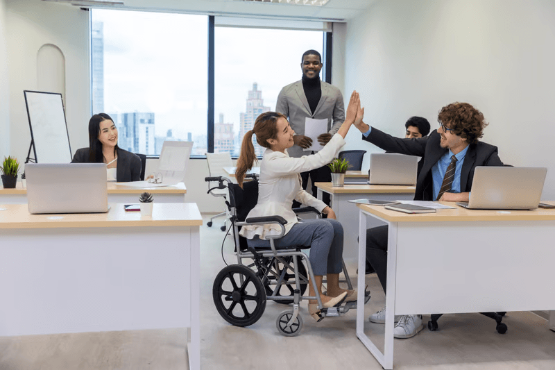 Team discussing accessibility solutions in office meeting