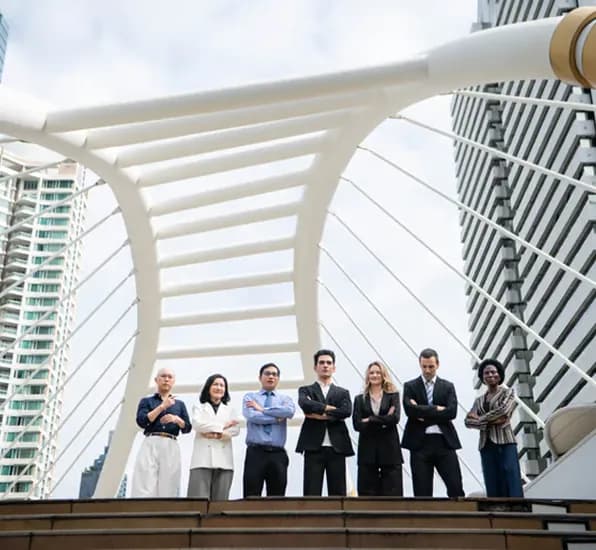 Team of professionals standing on a modern bridge