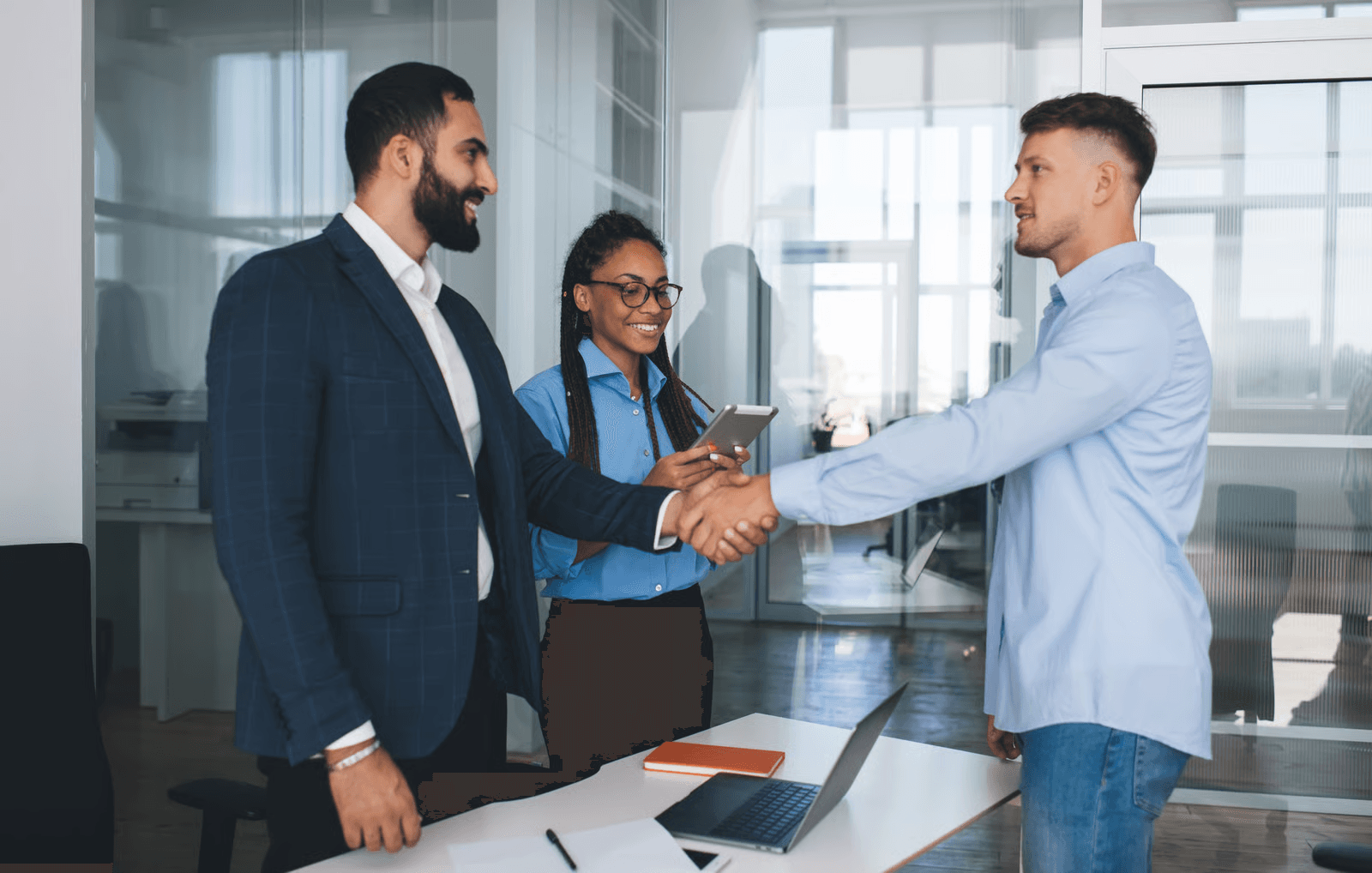 Business professionals shaking hands during onboarding