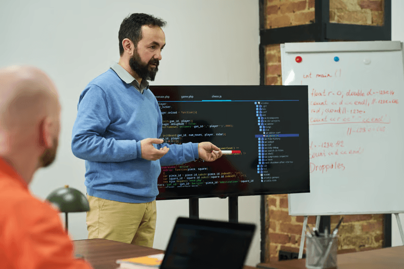 Engineers reviewing integration code architecture
