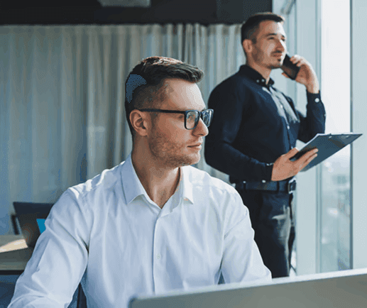 Security professionals reviewing documents in an office