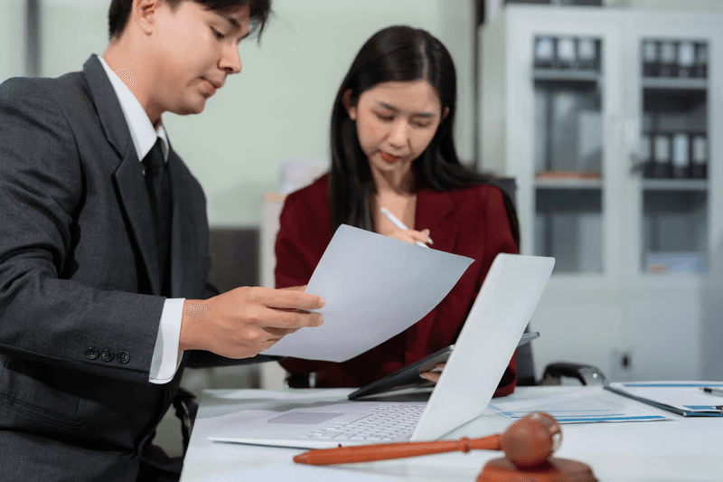 Procurement and executive managers evaluating vendor legal contracts