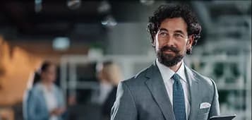 Professional in a suit standing in an office