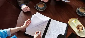 Documents being reviewed on a meeting table